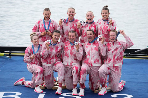 Women's eight rowing final: Canada's team pose after winning Silver 